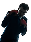 business man boxer with boxing gloves  silhouette