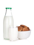 Glass, bottle of milk and cookies bowl