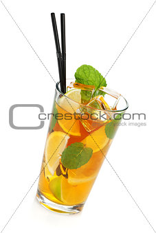 Glass of ice tea with lemon, lime and mint