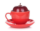 Ripe red apple in tea cup