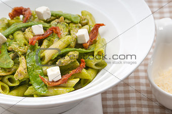 Italian penne pasta with sundried tomato and basil