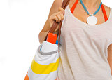 Closeup on sun block creme in bag of beach woman