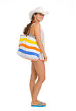 Full length portrait of happy beach young woman