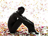 beautiful asian woman naked sitting with flowers petal silhouett