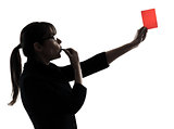 business woman whistling showing red card silhouette