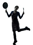 woman happy cooking holding frying pan silhouette
