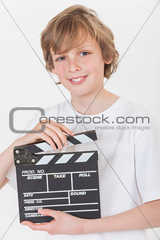 Happy Boy Smiling With Clapperboard