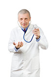 Mature doctor with stethoscope