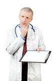 Mature doctor with blank sheet of paper