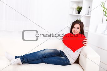 Girl showing big paper heart