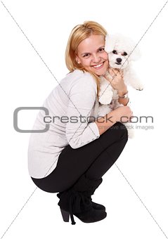Young girl holding puppy