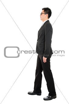 Asian business man walking