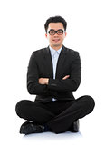Asian business man sitting on floor