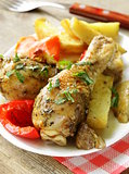 baked chicken legs with vegetables for garnish