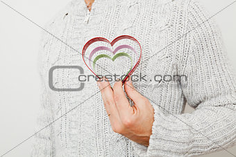 Heart symbols held in hand