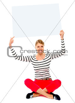 Woman holding banner ad over her head