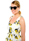 Smiling young woman wearing sunglasses