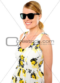 Smiling young woman wearing sunglasses