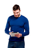 Man holding a computer tablet isolated on white background