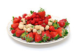 Ripe White and Red Strawberries on plate