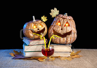 Funny Halloween pumpkins drinking wine
