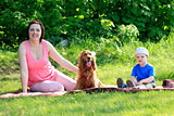 Mother, child and dog on picnic