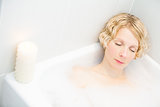 Young woman relaxing in the bath
