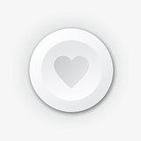 White plastic button with heart