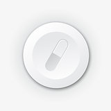 White plastic button with pill