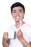 Asian guy brushing teeth