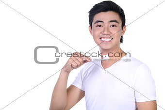Asian guy brushing teeth