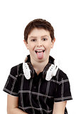 Young boy grinning and show tongue with headphones