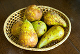 Pears in wicker bowl