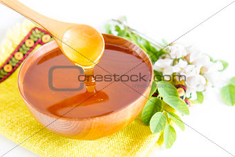 Honey in wooden bowl
