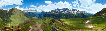 Summer Alps mountain pass panorama.