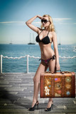 sexy blonde tourist with vintage bag