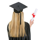 Woman in graduation gown with diploma . rear view
