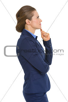 Profile portrait of thoughtful business woman
