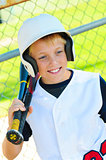 Cute baseball player in dugout