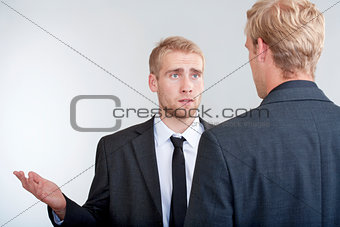 two businessmen discussing