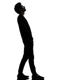 handsome african young man standing looking up surprise silhouet