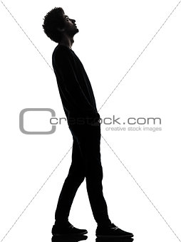 handsome african young man standing looking up surprise silhouet