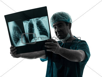 doctor surgeon radiologist examaning lung torso  x-ray image