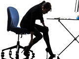 business woman massaging her leg silhouette
