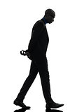 african black man walking looking down  silhouette