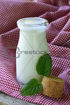 dairy products (yogurt, sour cream) in a glass jar