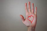 Red Heart Shape on a Hand
