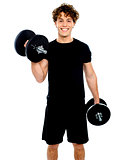 Smiling muscular man doing exercise