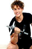 Fit trainer doing biceps exercise
