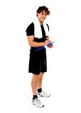 Full length portrait of male fitness trainer